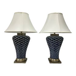 Pair of large lamps of tapering form, decorated in blue myriad fish pattern, on brushed chrome pedestals H75cm (including shades)