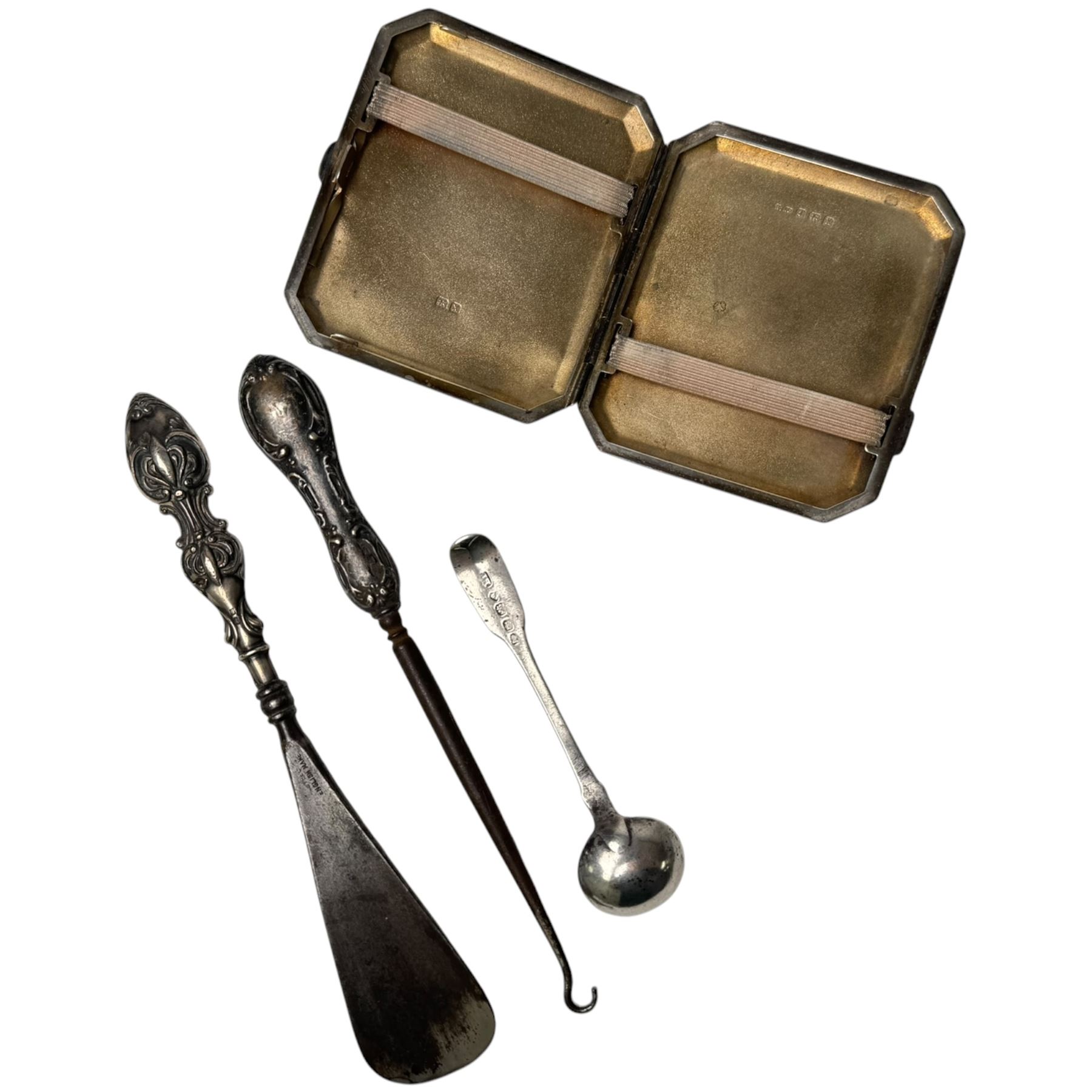 Silver cigarette case, silver spoon, and a silver handled button hook and shoe horn, all hallmarked 