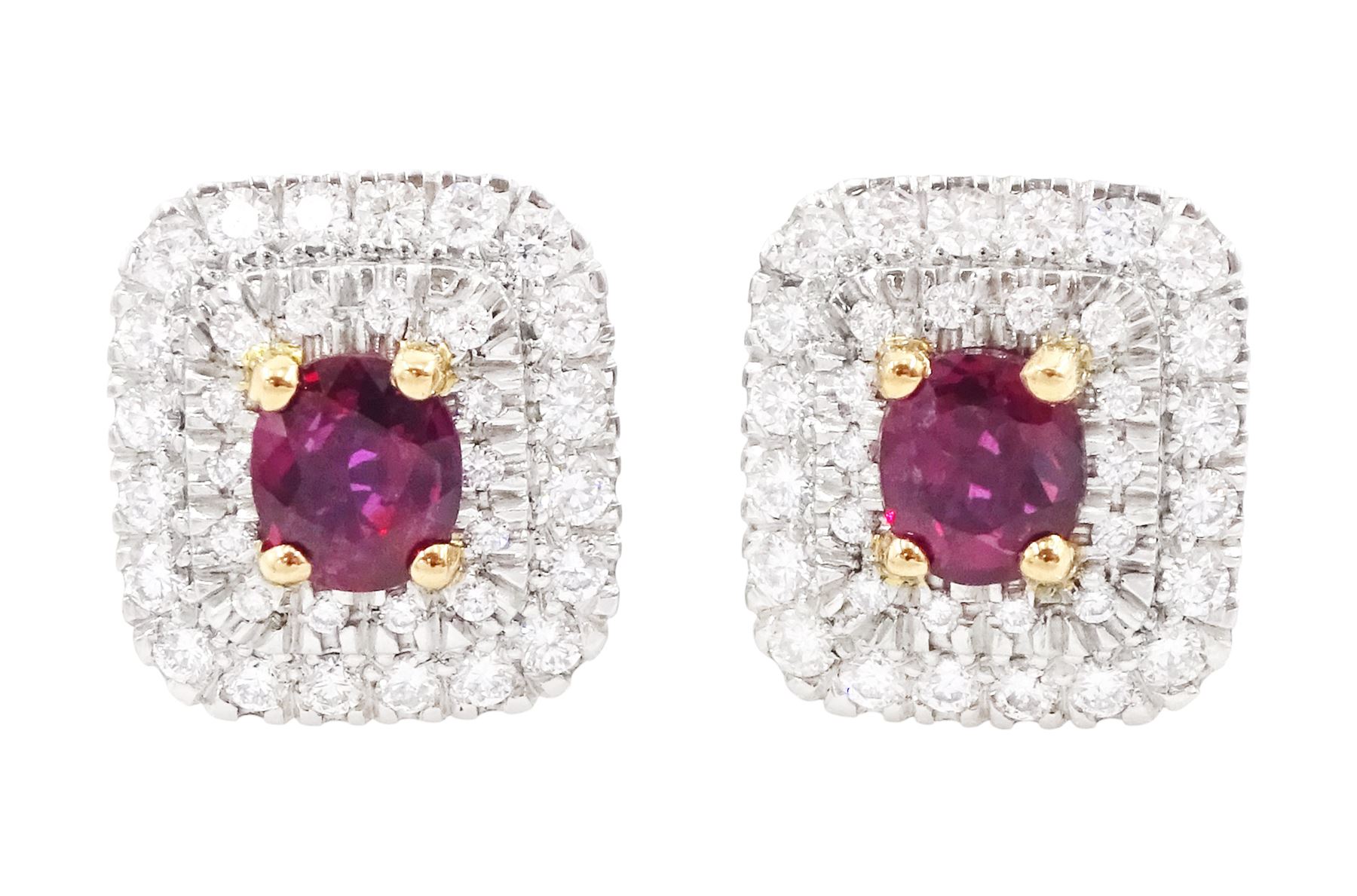 Pair of platinum ruby and diamond cluster earrings, each stud set with a single oval cut ruby in a four claw 18ct rose gold setting, surrounded by two rows of round brilliant cut diamonds, London 2017, total ruby weight approx 1.43 carat, total diamond weight approx 0.76 carat, with Alan Poultney Gems report