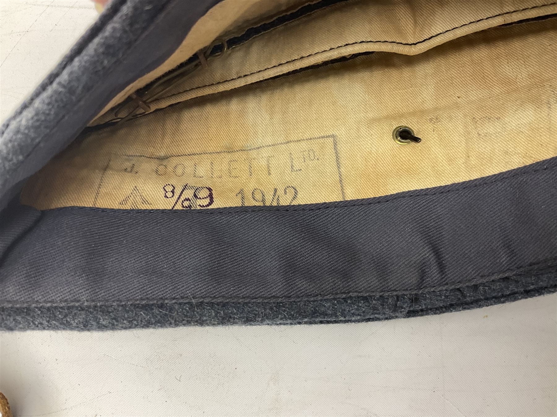 WW2 RAF sidecap dated 1942 with badge and buttons; quantity of RAF metal and cloth badges, pips and buttons; and paratrooper's helmet chin strap