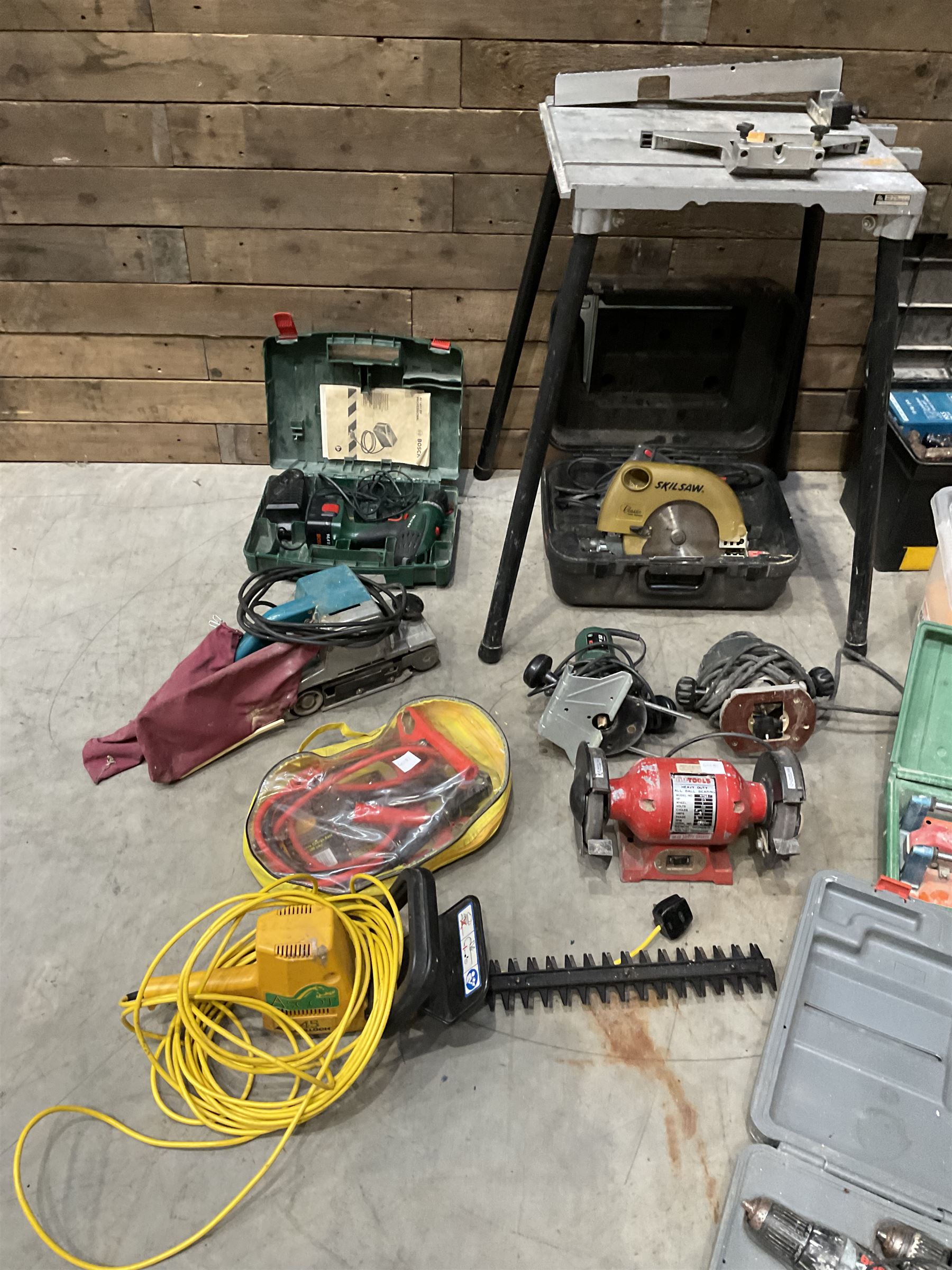 A quantity of power and hand tools including Skilsaw Classic circular saw, Makita 9401 belt sander, Bosch POF 52 router etc