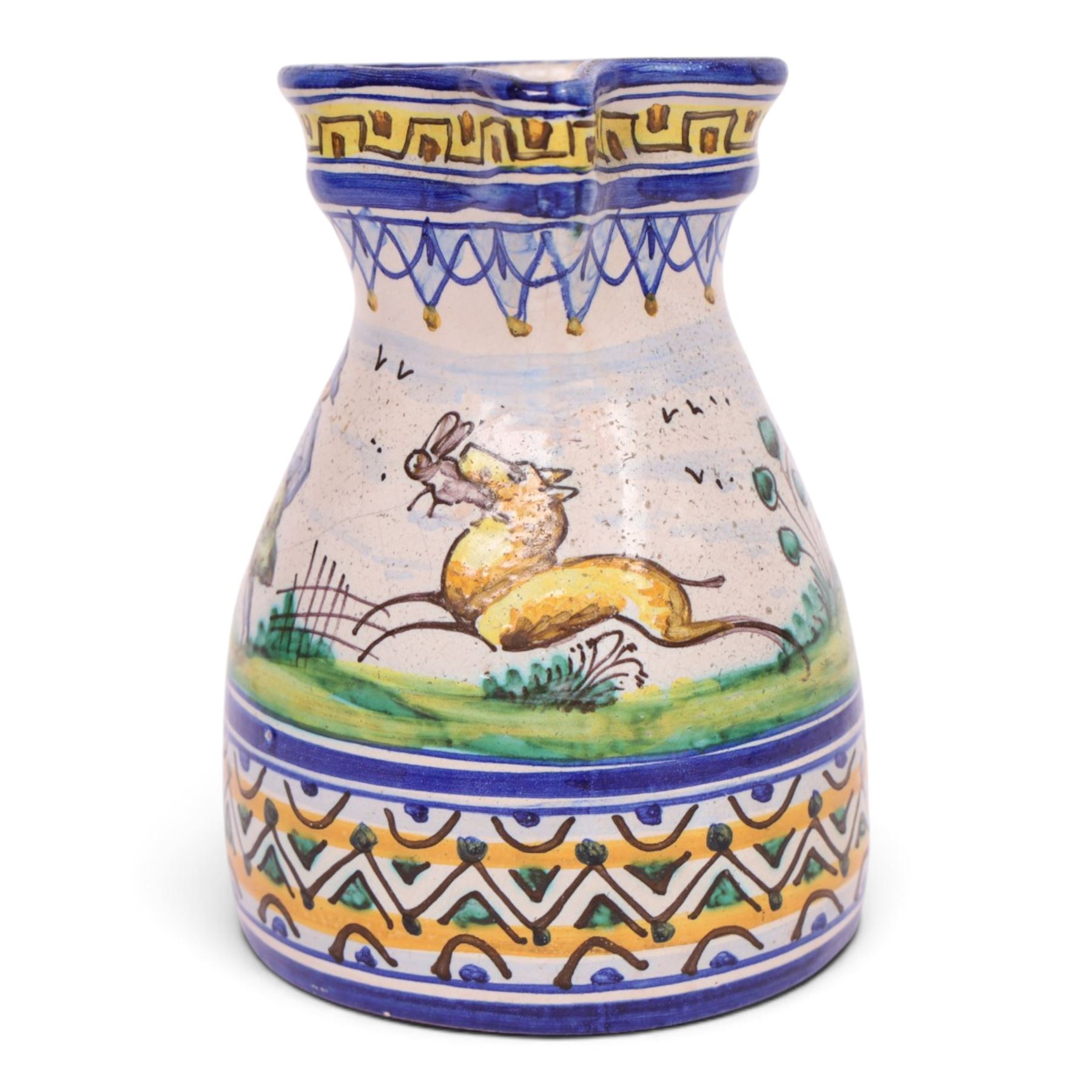 19th century Spanish faience jug with polychrome tin glaze decorated depicting a hunter and dog in a country scene within a geometric boarder, H18cm