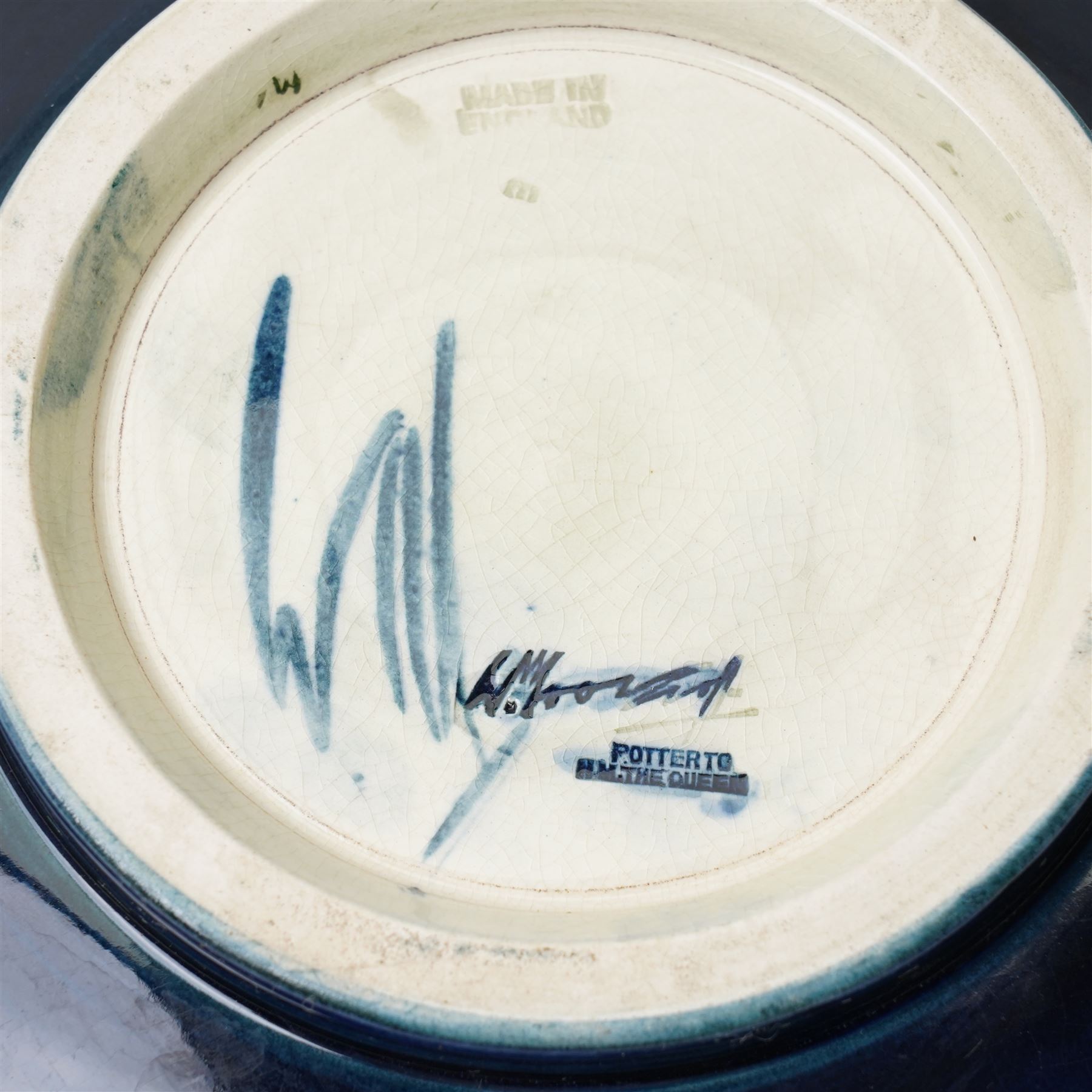 William Moorcroft African Lily pattern bowl, on a green ground, blue signature mark to base, D22cm