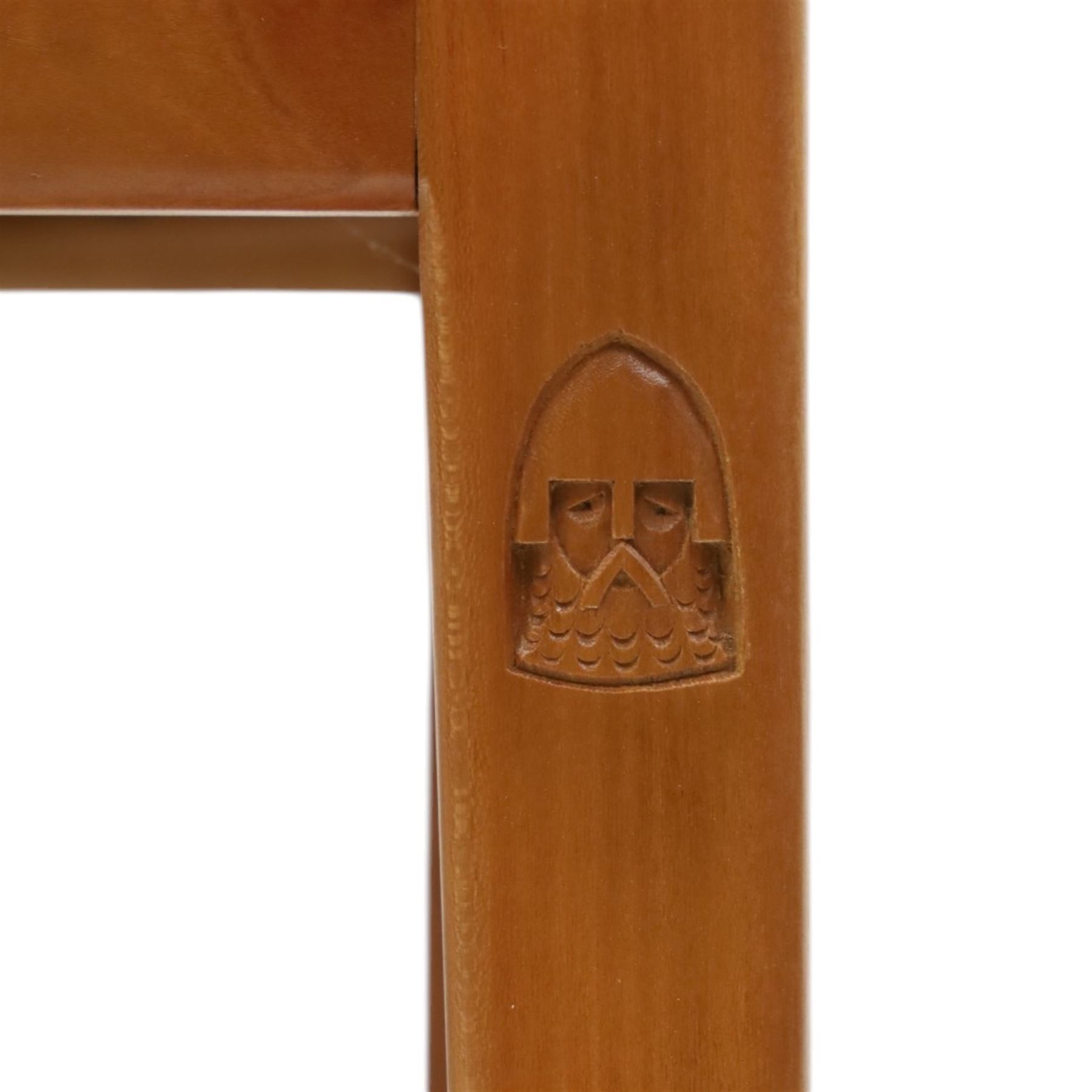 Knightman - set of nine cherrywood dining chairs, with fan splat backs and upholstered seats, raised on square legs joined by stretchers, comprising chairs of slight differing widths and one chair with turned front legs and orange upholstery and no Knight carving, the rest with recessed carved knight trademark, by Horace Knight of Old Mill Furniture, Balk near Thirsk 