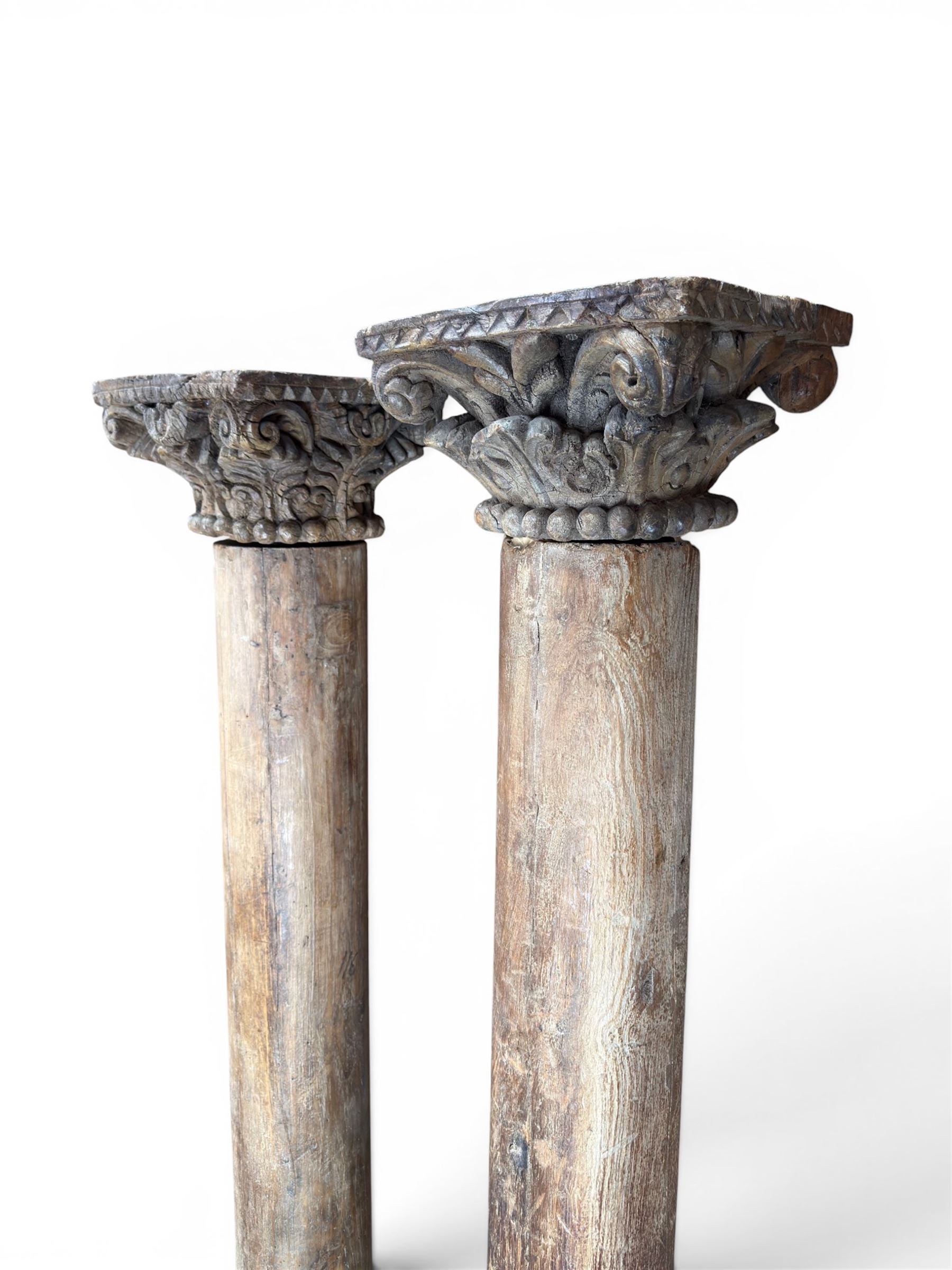 Matched pair of 19th century hardwood architectural columns with carved capitols, column diameter 18cm
