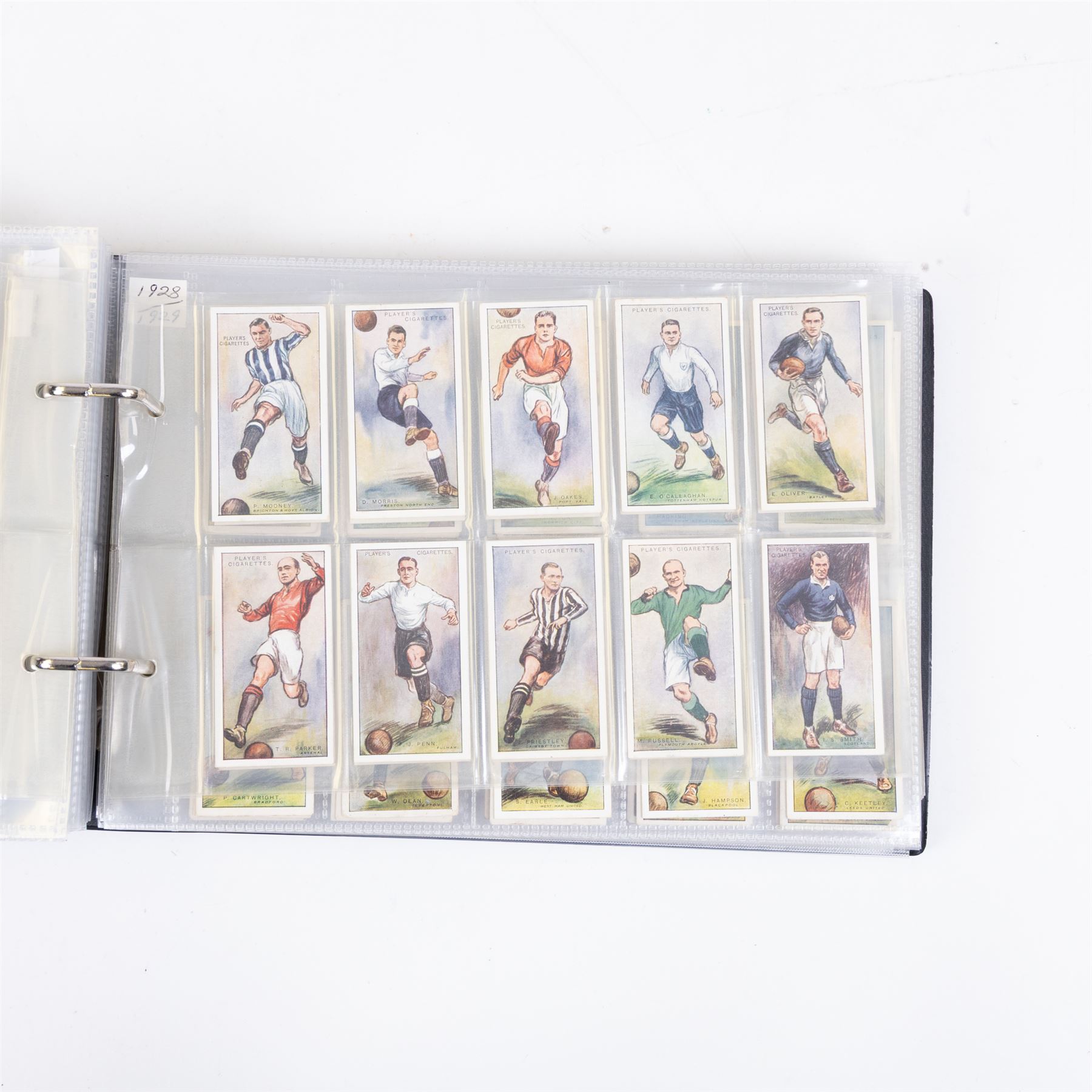 Collection of Edwardian and later Football related trading and cigarette cards, including forty-nine of fifty 1906 Ogden's Football Club Colours, 1922 PALS Footall series, ninety of one hundred 1925 Gallaher Famous Footballers, complete set of forty-four 1926 Ogden's Captains of Association Football Clubs and Colours, complete set of fifty 1927 Players Football Caricatures by MAC,  complete set of fifty 1927 Players Football Caricatures by RIP,  complete set of fifty 1930 Players Association Cup Winners, complete set of 50 1933 Ogdens AFC Nicknames etc, housed in brown cigarette card album
