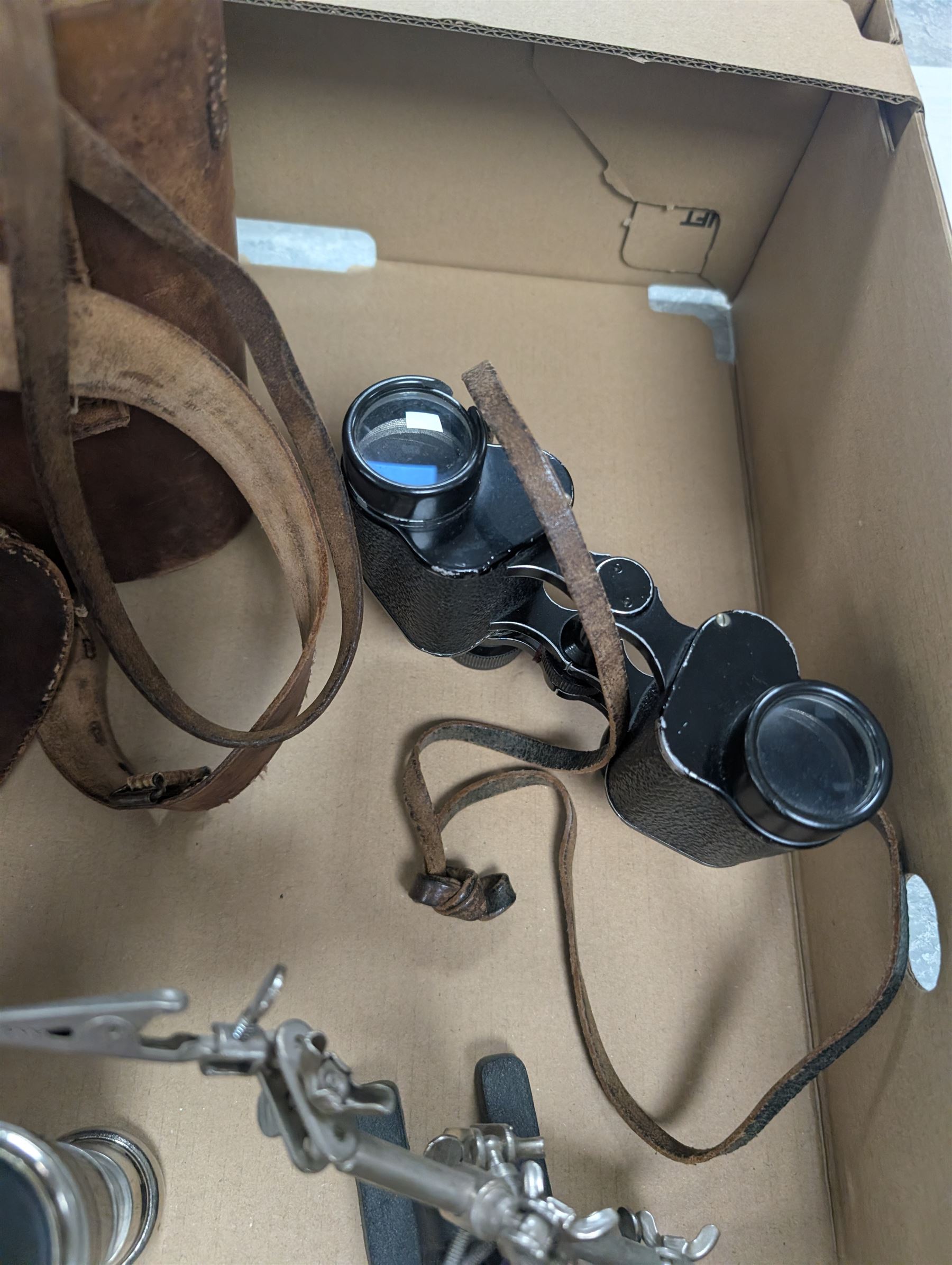 Three pairs of binoculars including Wrayvu 8x30 and Busch Hellux, together with a tabletop magnifying glass