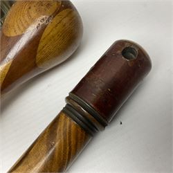 Three early 20th century walking sticks, to include a smoking pipe walking stick, the cane opening to reveal a concealed pipe, and a wooden walking cane, the metal cover with inscription 'bell metal and wood of York Minster, Burnt May 20 1840, and a turned wooden walking stick, with marquetry checkerboard pommel, tallest L90cm