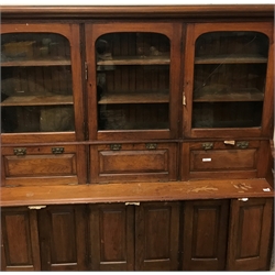  Victorian walnut secretaire bookcase, projecting cornice, three glazed cupboard above three fall fronts enclosing drawers and fitted interior, six cupboard doors, turned supports, W191cm, H207cm, D49cm  