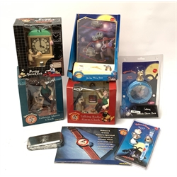  Wallace & Gromit Wesco promotional items - three talking alarm clocks, another with moving parts playing music from A Close Shave, wristwatch in presentation tin with shop counter-top easel advertising card,  wristwatch with interchangeable character head cover and Zig-Zag Money Bank, all in original packaging (7)  