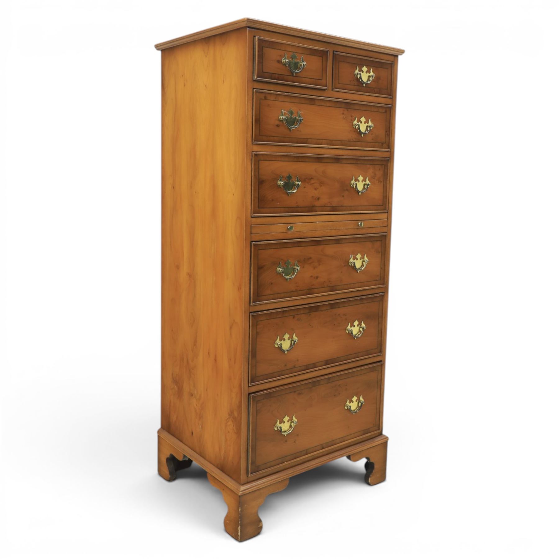 Georgian design yew wood pedestal chest, fitted with seven drawers and slide, brass drop handles