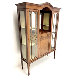 Edwardian inlaid mahogany display cabinet with ‘Shepard, Bennington & Co. Doncaster’ makers plaque, central bevel edge mirror flanked by two glazed doors enclosing two lined shelves, single drawer above cupboard on square tapering supports with spade feet