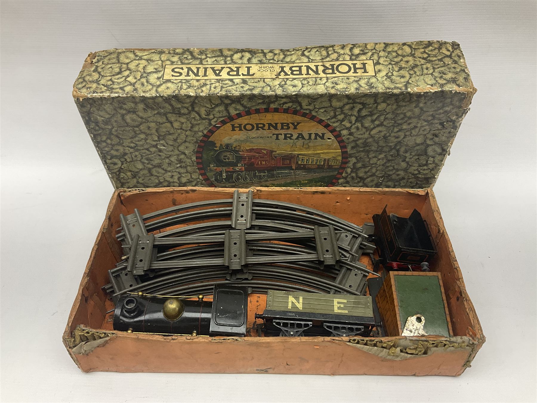 Hornby ‘0’ gauge - No. 0 Goods Set box containing clockwork LNER 0-4-0 locomotive with matching tender no.2710 in black and gold, originally from the No. 1 Goods Set; with NE open wagon, quantity of track, track clips, buffer and key 