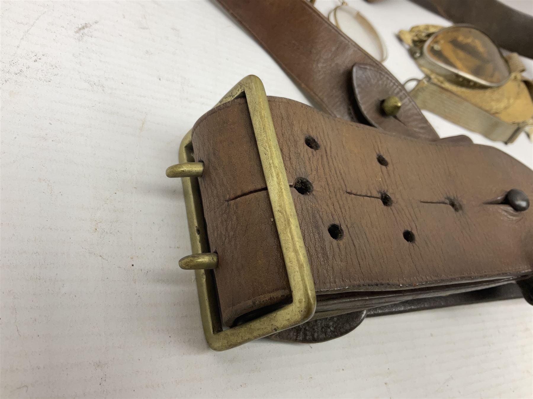 British Army Sam Brown leather belt with Turkish markings; New Zealand Land Forces officer's commission certificate dated 1919; WWII small pair of trench art brass helmet shaped scuttles; and other items