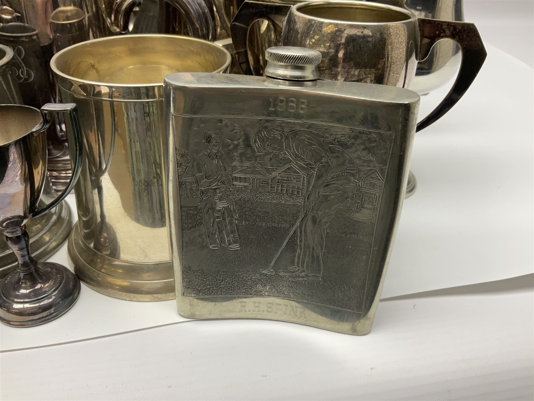 Collection of pewter and silver-plated trophy cups and presentation tankards, largest H28cm
