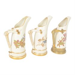 Four Royal Worcester tusk jugs of curved cylindrical form, the handle in the form of a gilded deer's antler, all decorated with floral sprigs, with puce marks beneath and numbered 1116, largest H29cm