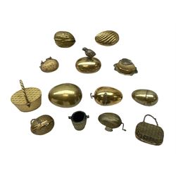 Eleven 19th century and later metal thimble cases, most examples in egg form, together with egg shaped tape measure