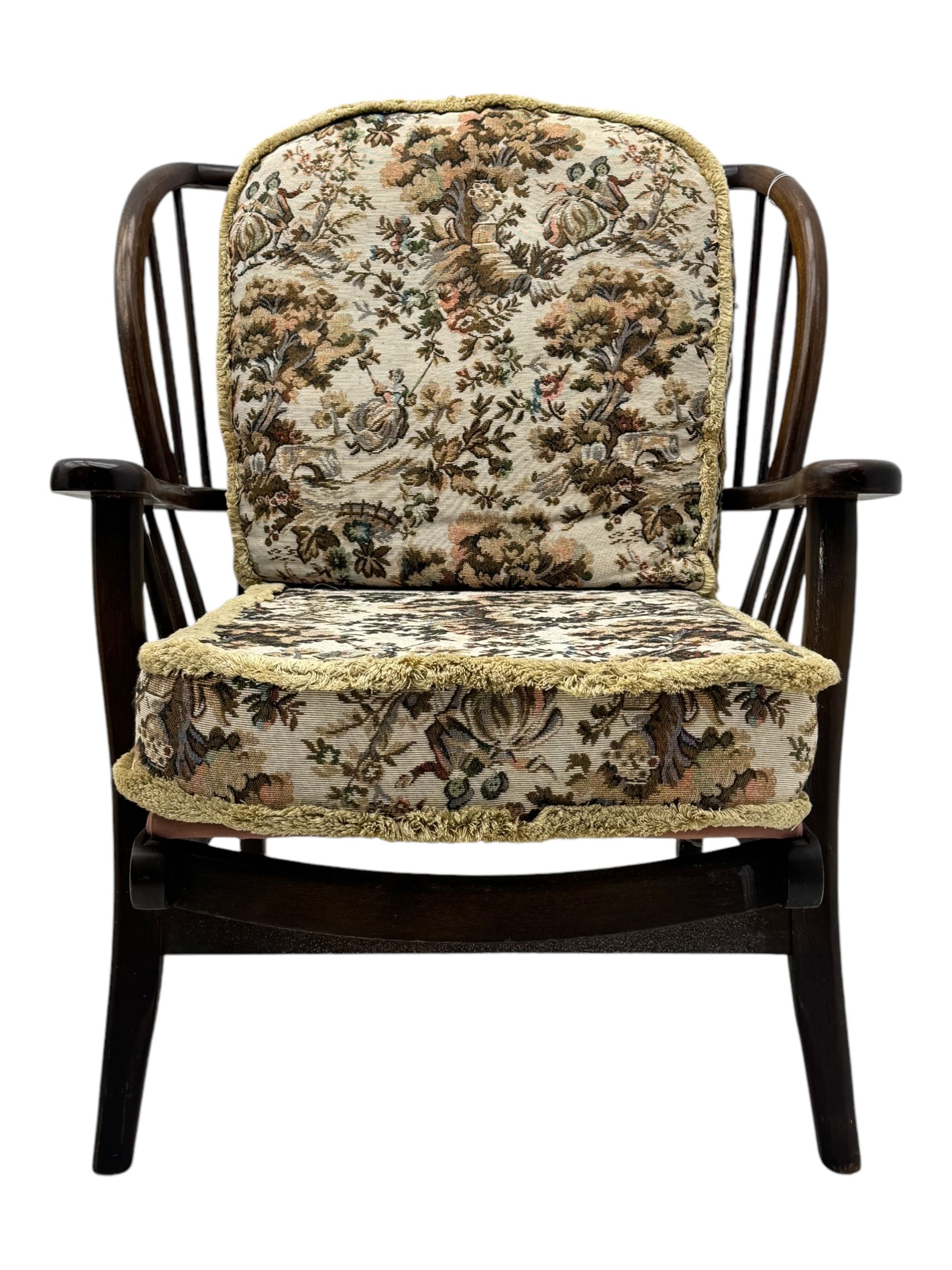 Joynson Holland - pair of mid-20th century stained beech framed easy chairs, shaped back and flat armrests over floral tapestry cushioned seat and back, on splayed supports united by stretcher