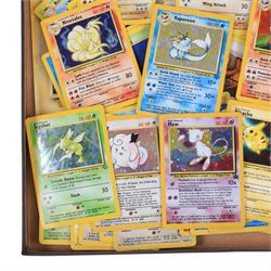Collection of  Wizards Of The Coast Pokemon trading cards including Base Set, Jungle Set, Fossil Set and Team Rocket examples, black star promo Mew, Arcanine and Pikachu, holo Ninetales and Clefairy, 1st edition pre-release holo Aerodactyl, Team Rocket Dark Machamp holo and Jungle set Flareon, Vaporeon and Scyther holos 