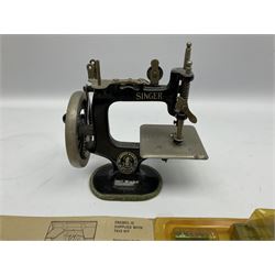 Dinky Kit No.1029 Ford D800 Tipper Truck in unopened original packaging; American Singer child's sewing machine; Spong's table mounting Bean Slicer No.632; and two wall mounting wooden die-cast model open display racks (5)