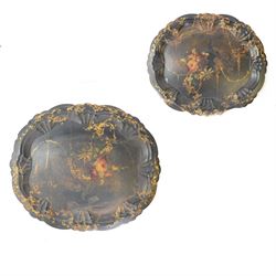 Pair of Victorian papier mache and lacquered trays with raised shaped border and gilded de...
