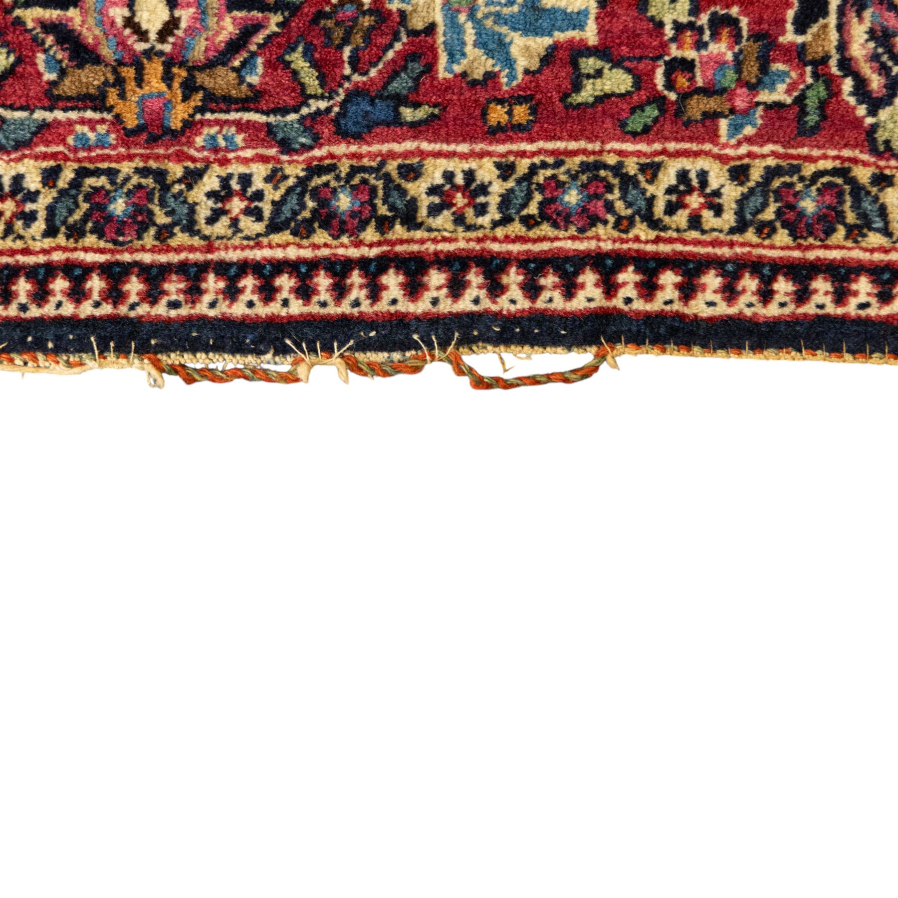 Persian Sarouk rug, richly decorated with an elaborate central medallion of palmettes and stylized floral motifs in indigo, ivory, and pastel tones on madder red ground, framed by spandrels, with a broad border of flowering palmettes and serrated leaves between a narrow floral guard border, fringe removed 