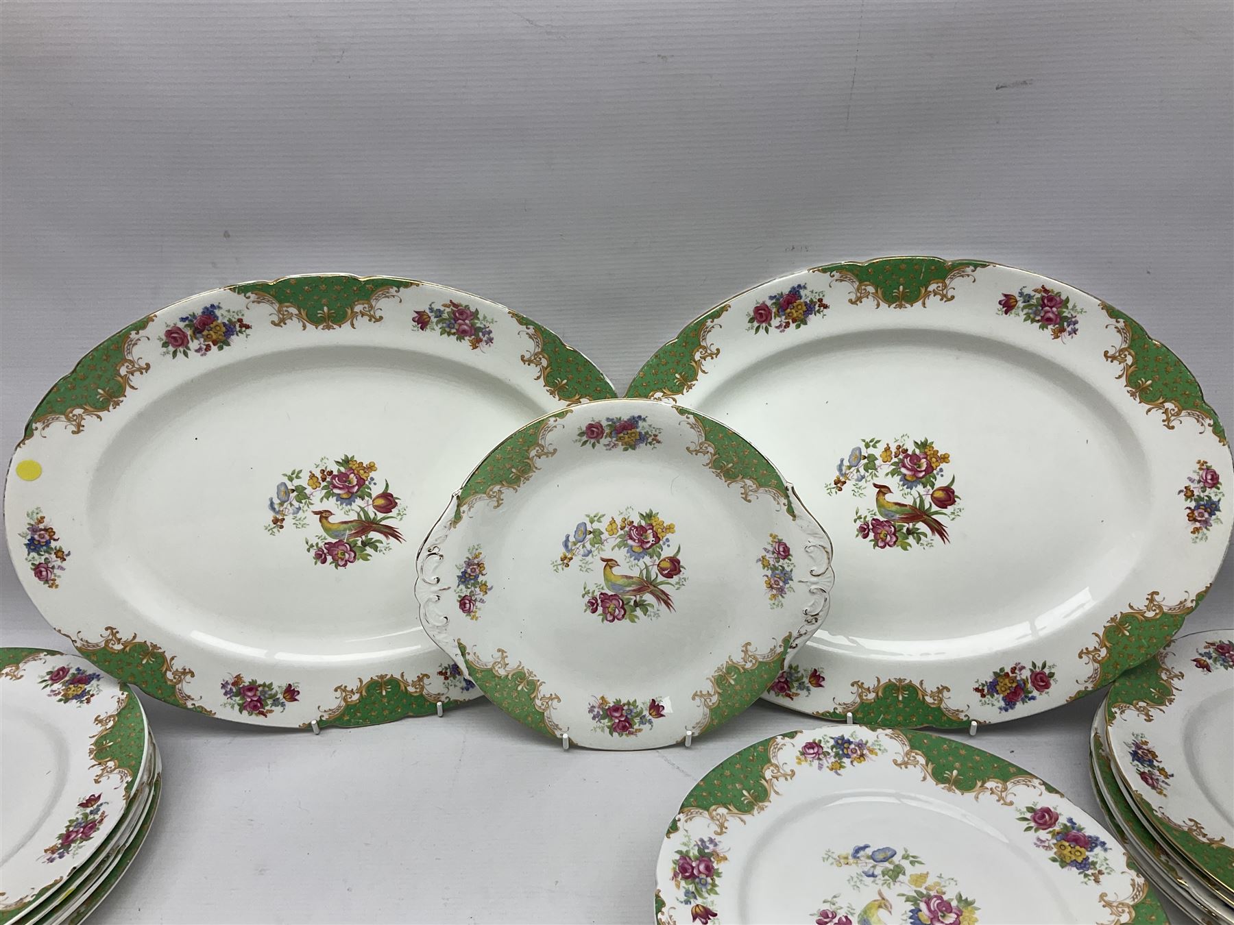 Paragon Rockingham pattern part tea and dinner service including three teapots, milk jug, cups and saucers of various sizes, ten soup bowls, ten side plates, ten dinner plates etc (96)