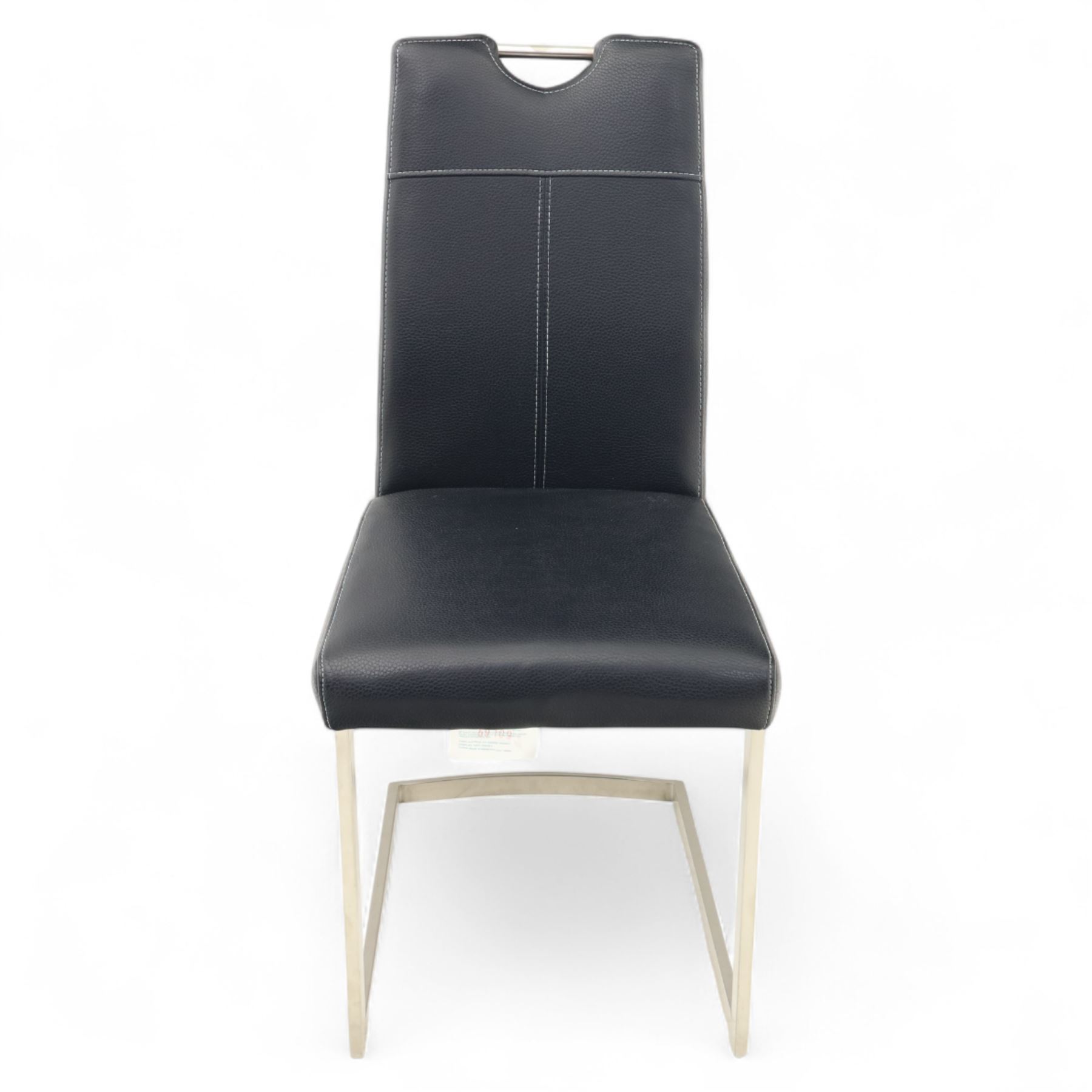 Set of seven contemporary style dining chairs, each with a high padded back and seat upholstered in faux leather on brushed steel sled bases  