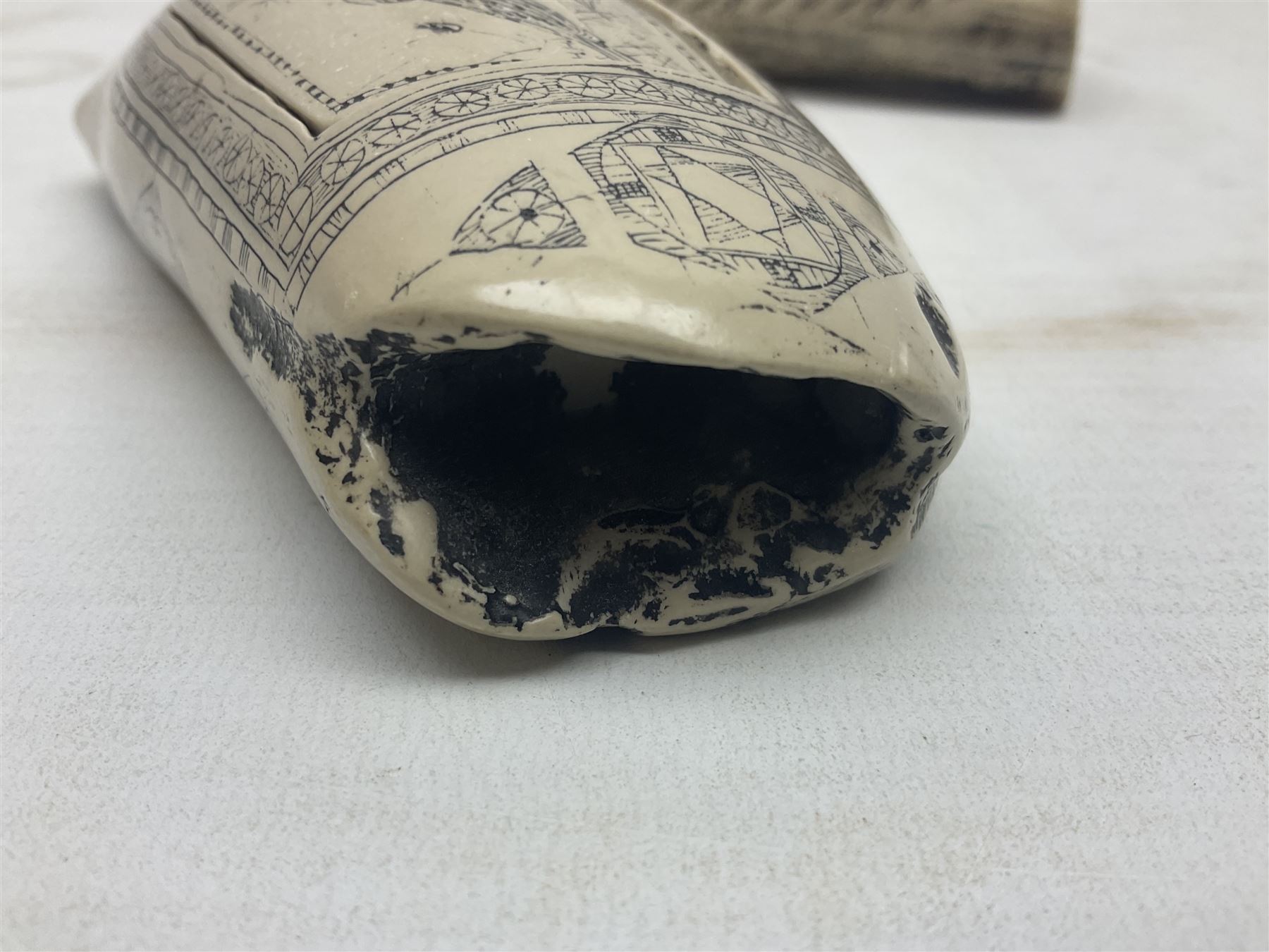 20th century resin carvings in the style of scrimshaws the first example depicting Ship Mercury, the other with a removable top, tallest example H10.5cm