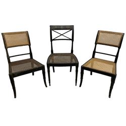Collection of Regency dining chairs - set of four Regency painted beech dining chairs, with cane seat and back, on collar turned supports with splayed feet (W46cm, H84cm); a pair of Regency ebonised dining chairs (W47cm, H77cm); and a single Regency dining chair, the cresting rail painted with floral cornucopias and central putto vignette, X-frame back over cane seat, on collar turned front supports painted with foliage (W46cm, H84cm) (7)