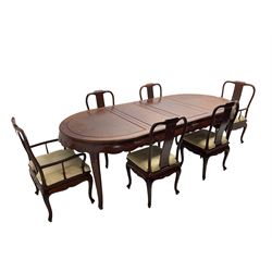Mid to late 20th century Chinese hardwood extending dining table, two additional leaves, shaped apron carved with foliate scrolls, leaf carved cabriole supports (W246cm, H78cm, D117cm), and set six (4+2) dining chairs with shaped cresting rails over carved splats