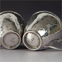 Pair of Chinese export silver teacups, both decorated with character marks, one with floral decoration, the other decorated with a bird within bamboo branches, both with indistinct maker's marks beneath, H6cm