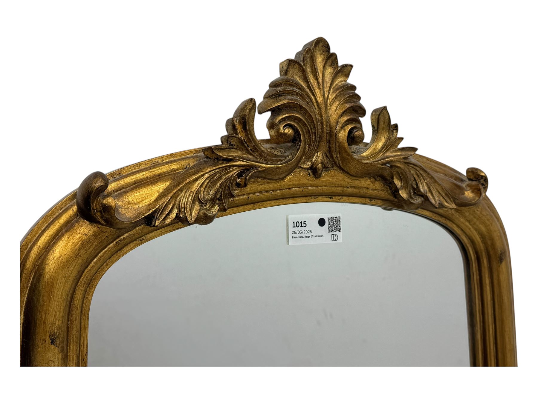 Narrow Victorian design gilt framed wall mirror, anthemion and scrolled acanthus leaf pediment over moulded frame, plain mirror plate 