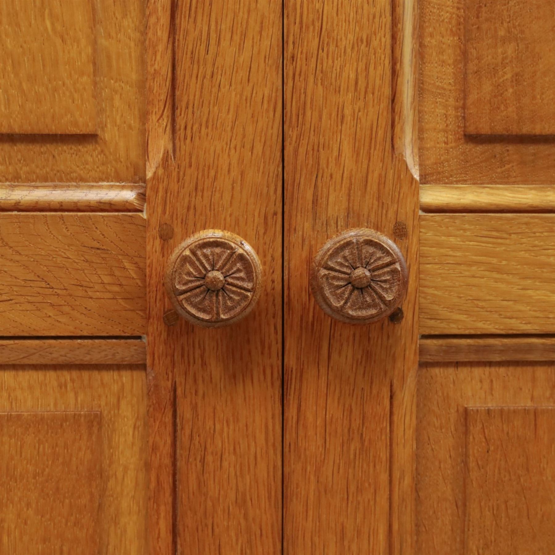 Beaverman - oak double wardrobe, enclosed by twin multi-panelled doors, Yorkshire Rose carved handles, the interior fitted with shelf and hanging rail, with signature carved beaver, by Colin Almack of Sutton, near Thirsk