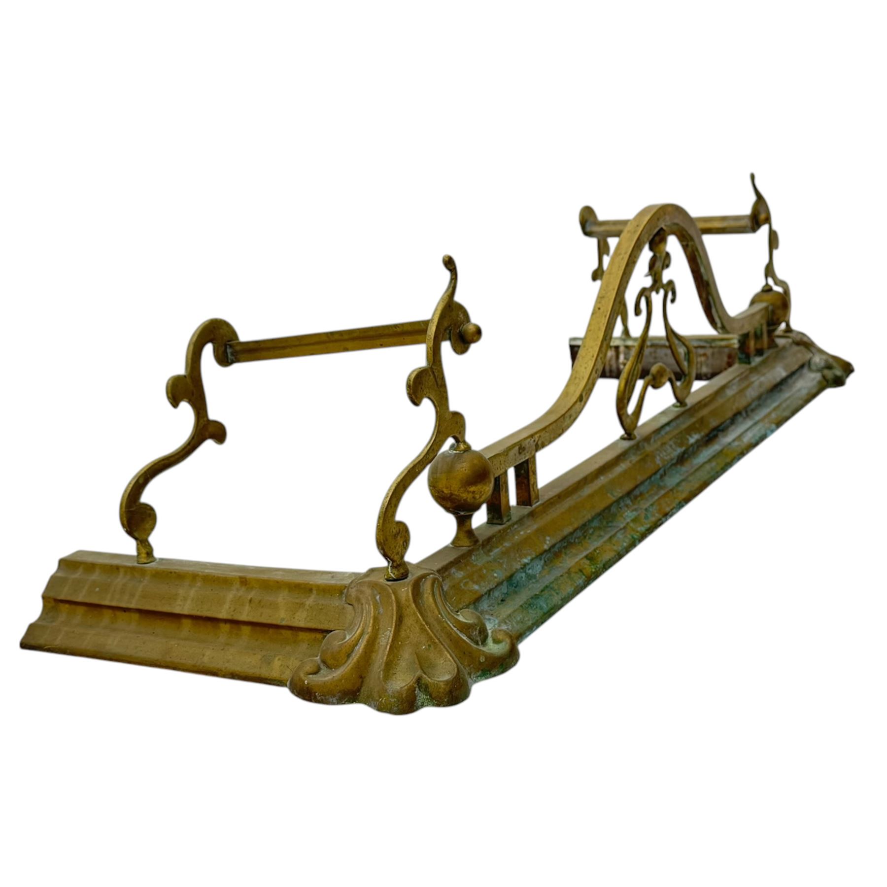 Three 20th century brass fenders, two with pierced Art & Crafts design rails, largest W156cm, D 45cm 
