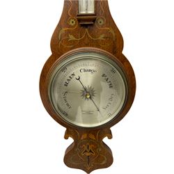 An early 20th century oak cased aneroid barometer in a decorative form with inlay in the arts and crafts style c1920, with a 7” silvered register indicating barometric pressure from 28 to 31 inches with predictions, steel indicating hand and brass recording hand, dial inscribed “Pearce & Sons, Leeds, York and Leicester” within a brass bezel and flat bevelled glass, detachable surface mounted mercury thermometer within a glazed box recording the temperature in degrees Fahrenheit and Celsius. 
Pearce & Son Jewellers are one of the county's longest established jewellers having been founded in 1838 by Mr. Henry Pearce, in Grantham, Lincolnshire, opening further shops in Huddersfield, Leeds, York and Leicester during the early 20th century.
	


