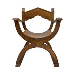'Gnomeman' oak curved x-framed throne chair, sloped arched cresting rail carved with arcade, studded slung leather seat, the supports joined by sledge feet, rear upright carved with gnome signature, by Thomas Whittaker of Littlebeck