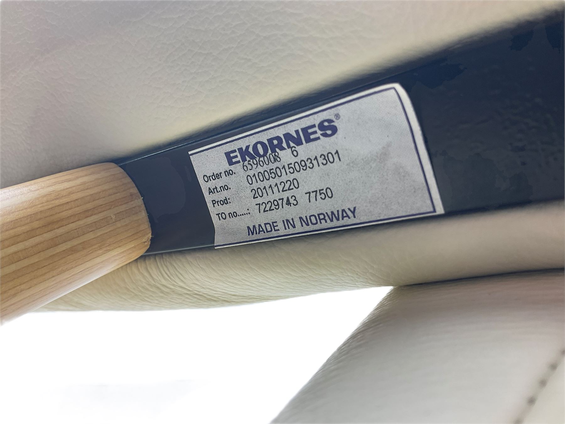 Ekornes - Stressless armchair upholstered in cream leather with matching footstool 