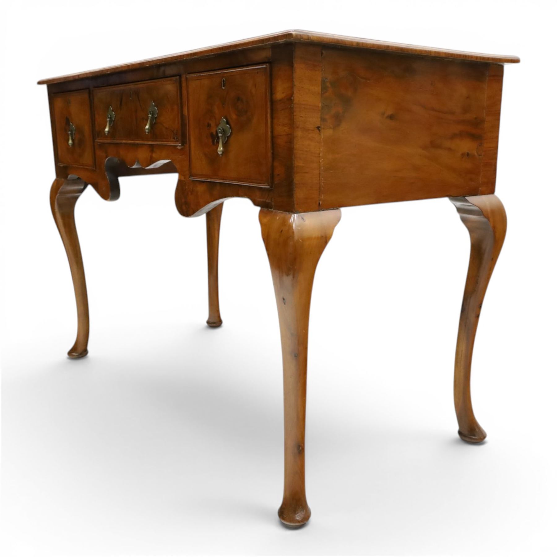 Queen Anne Design walnut kneehole desk with matching chair, rectangular figured top with crossbanding, three frieze drawers, raised on cabriole supports, the chair with serpentine front raised on cabriole supports