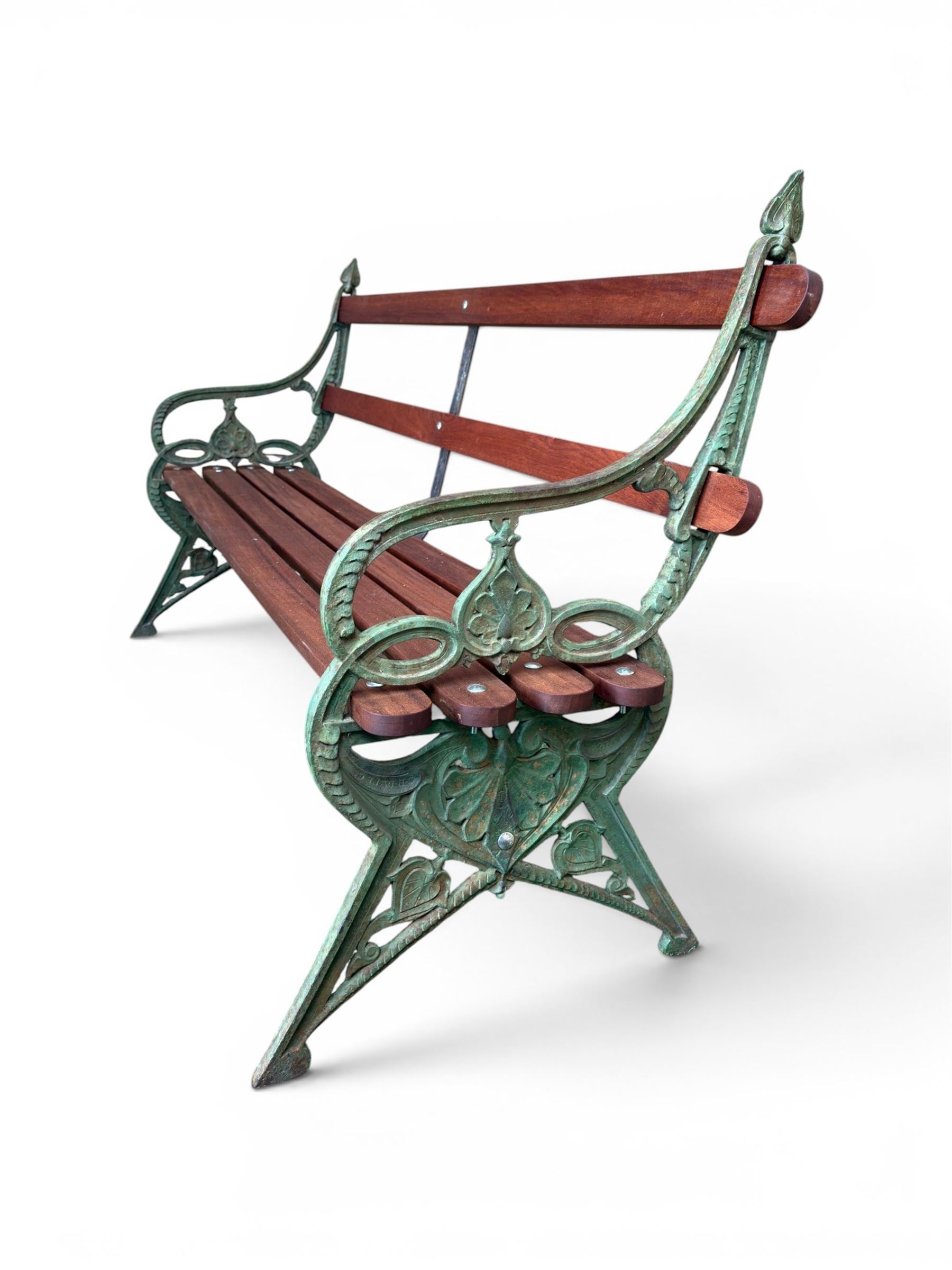 Coalbrookdale - Lily Pad design cast iron an wood slatted garden bench, late 19th century Aesthetic Movement, no. 217569, distressed green paint, iron centre support and seat stretcher, hardwood slatted