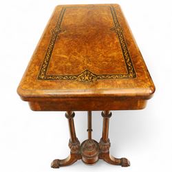 Victorian walnut and inlaid games table, rectangular fold-over top with figured walnut veneers and foliate inlay, swivel and fold over to reveal a green baize lined playing surface, on twin supports united by a stretcher, raised on scroll carved feet with castors (extended 96cm x 92cm)