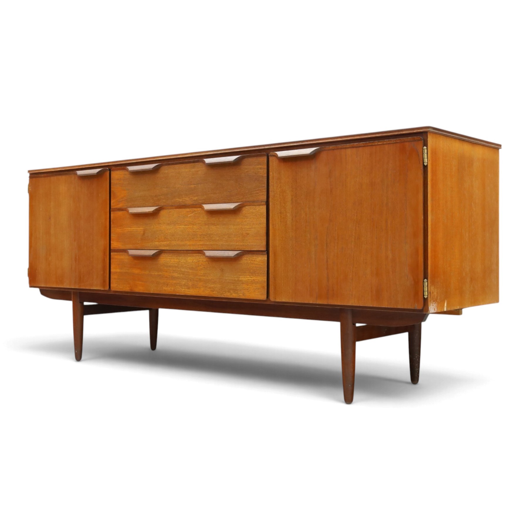Frank Guille for Austinsuite - mid-20th century teak sideboard, fitted with three central graduating drawers flanked by cupboards, on tapering supports