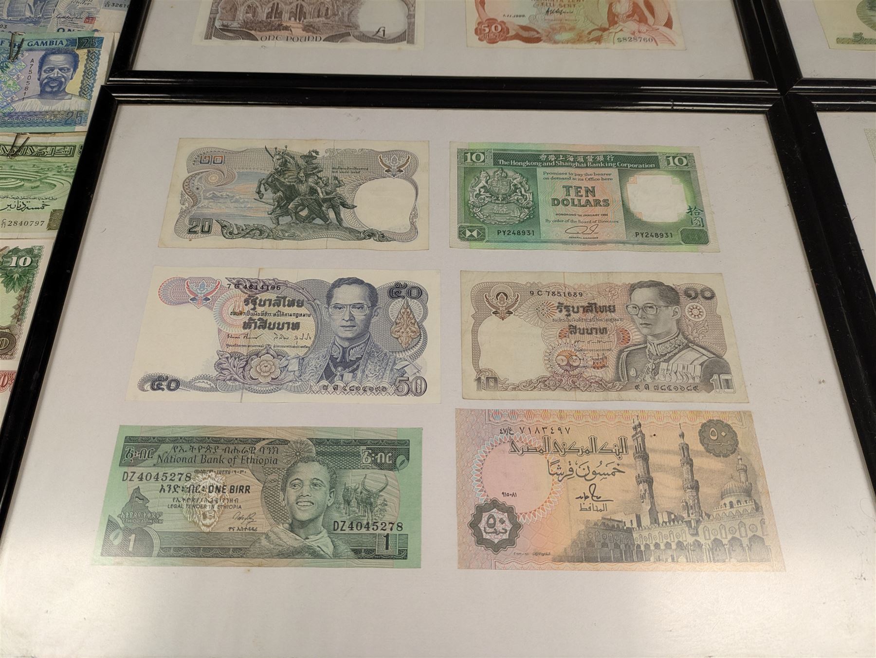 World banknotes, including Central Bank of Nigeria, Indonesia, Central Bank of Egypt, Republic of Liberia, Central Bank of Kenya, Central Bank of the Gambia, Singapore, Belgium etc, loose and in five framed displays