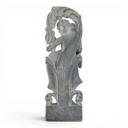 Stone carving of goddess, together with material with gold thread decorated with stylised flowers 
