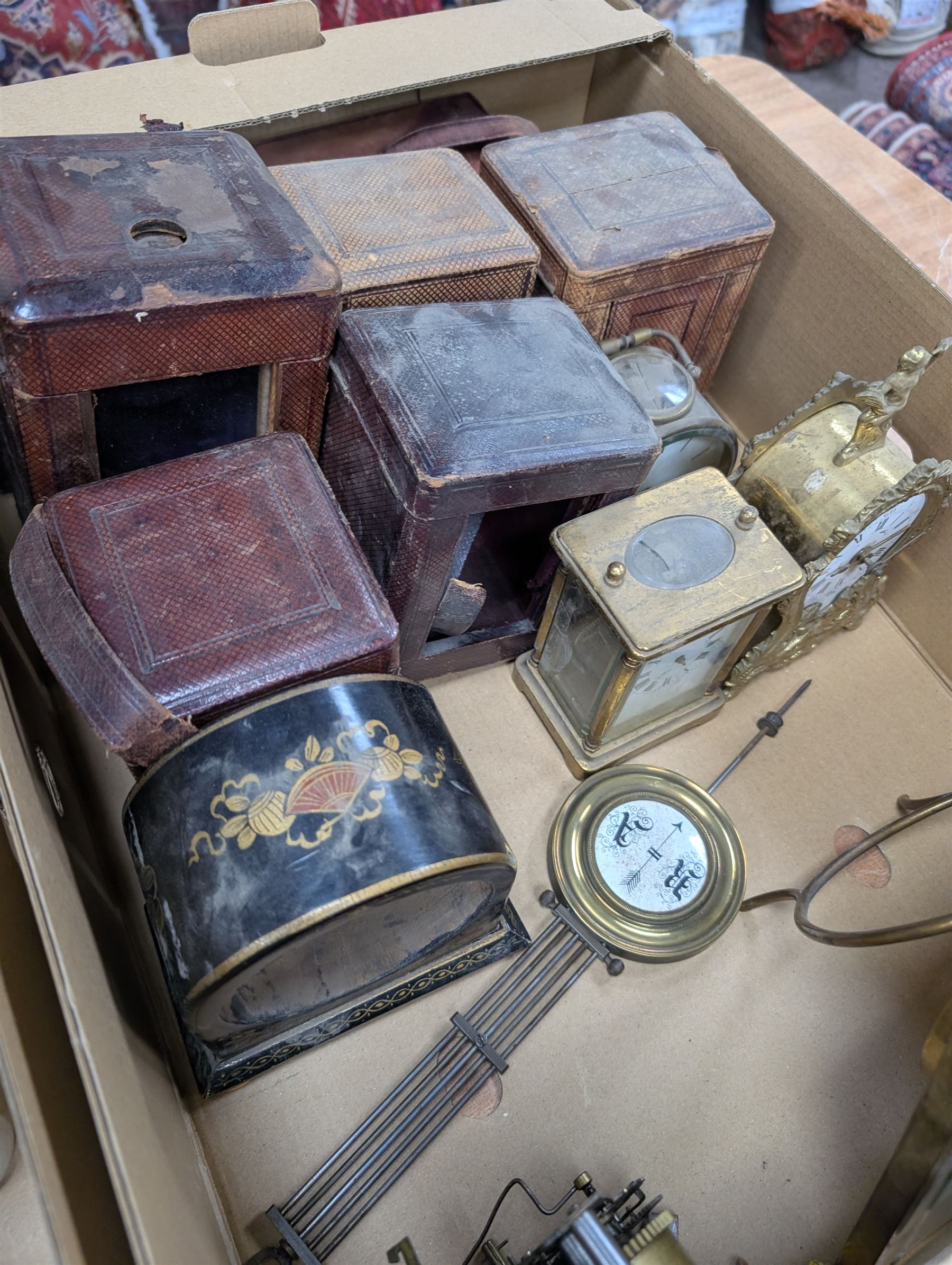 Collection of leather carriage clock cases, brass mantle clocks and parts, brass candlesticks etc, in two boxes