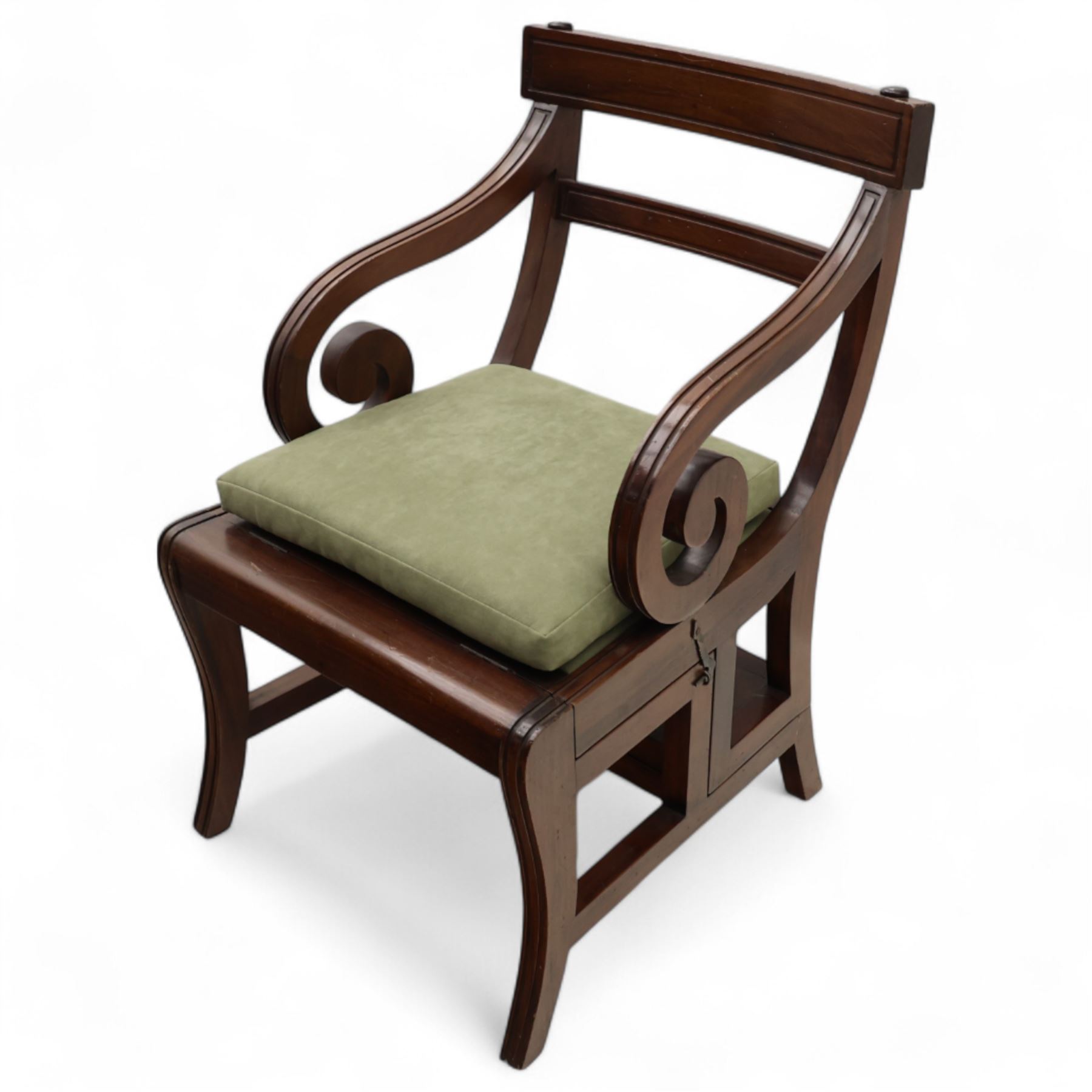 In the manner of Morgan & Sanders - early 20th century Regency design mahogany metaphoric library chair and steps, rectangular panelled top-rail with applied roundels with scrolling arms and upholstered seat and cushion, hinged and folding design transforming into four carpeted steps

Reference: The present lot is based on a design for a metamorphic library chair published by Morgan & Saunders circa 1810, P.Agius, Ackermann's Regency Furniture & Interiors, plate 29, page 60