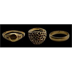 Three 9ct gold rings, comprising wedding band, pierced dome ring and signet ring with engr...