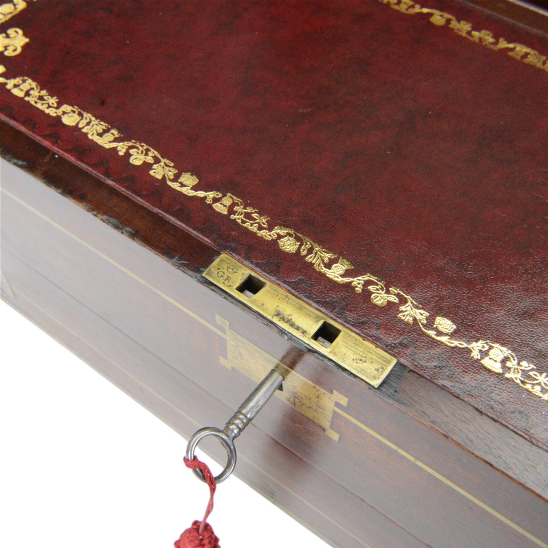 19th century brass bound mahogany writing slope with twin drop carry handles to sides, the hinged cover opening to reveal a  gilt tooled burgundy leather slope and compartmented interior, H22xm W50.5cm D30cm