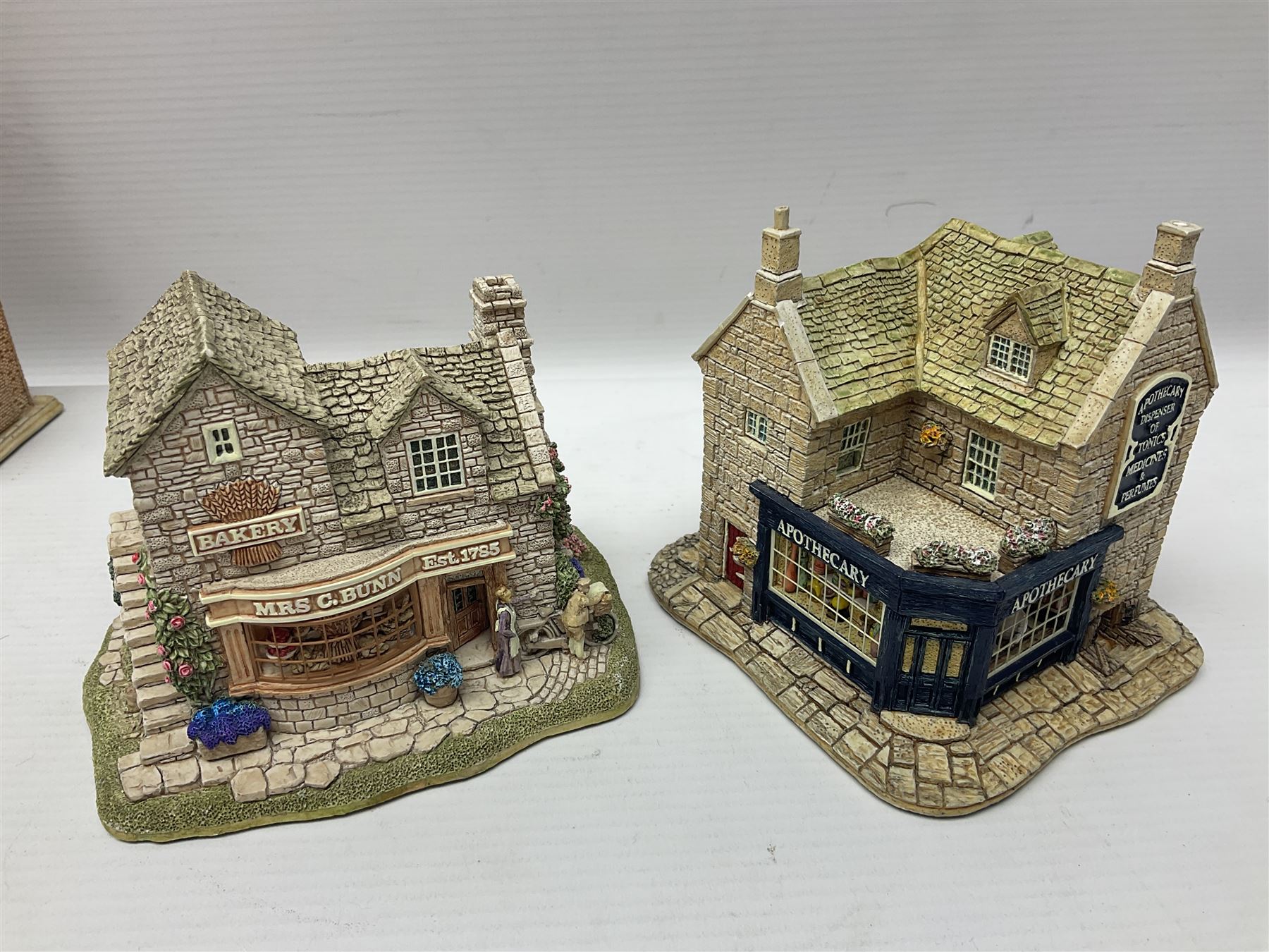 Thirteen Lilliput Lanes from the Shops Collection, including Apothecary, Horologist, China Shop, Penny Sweets, H Samuel etc, all with deeds and original boxes 