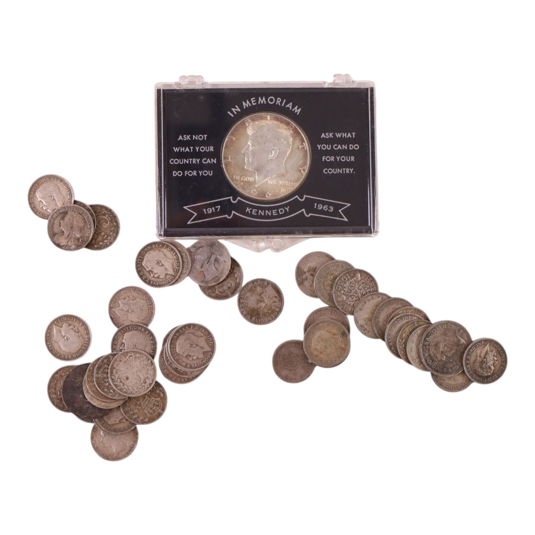 Approximately 39 grams of Great British pre-1920 and approximately 22 grams of Great British pre-1947 silver coins, mainly threepences, together with a United States of America 1964 'Kennedy' silver half dollar and two small silver coins